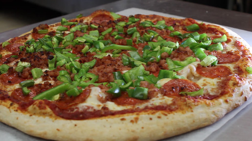 cooked pizza with green peppers 2